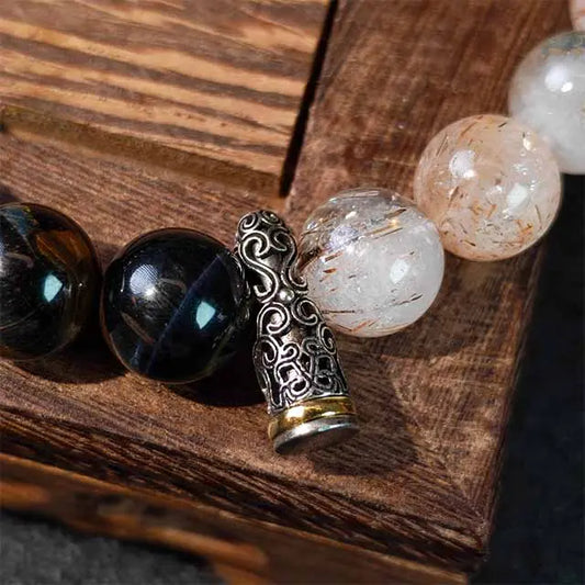 Meaningful gift idea: This powerful Tiger‘s Eye and Super Seven crystal bracelet in Tibetan silver helps with energy protection and balance, perfect for mindfulness and wellness enthusiasts.