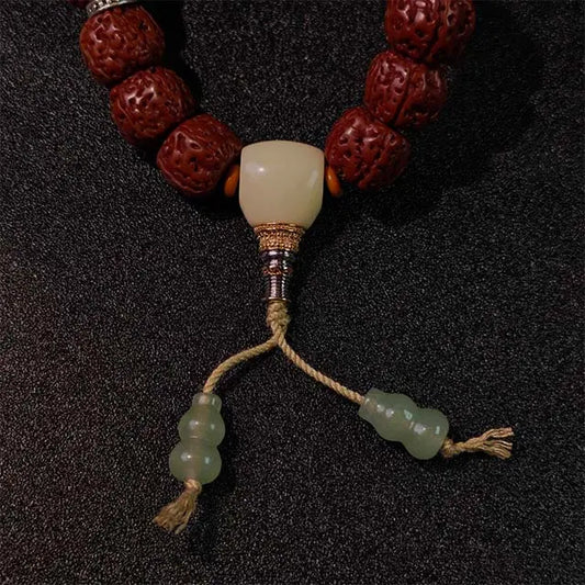 Bohemian-style unisex Bodhi bracelet with natural seeds and wooden beads, ideal for adding positive energy to casual or spiritual outfits.