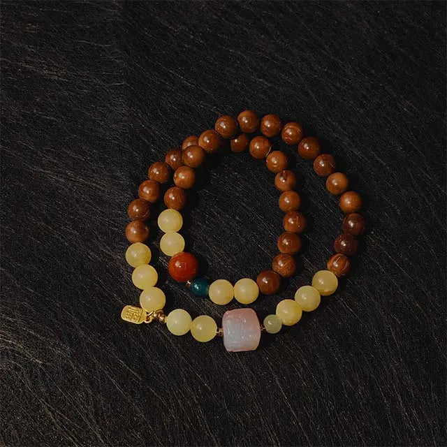 Handmade Bodhi and Jade Double Loop Mala Bracelet for Buddhist meditation, mindfulness, and attracting positive energy. Features natural Bodhi seeds and green jade beads.