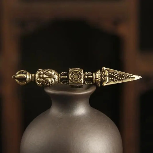 solid brass dorje pendant tibetan style handcrafted ornament with symmetrical design