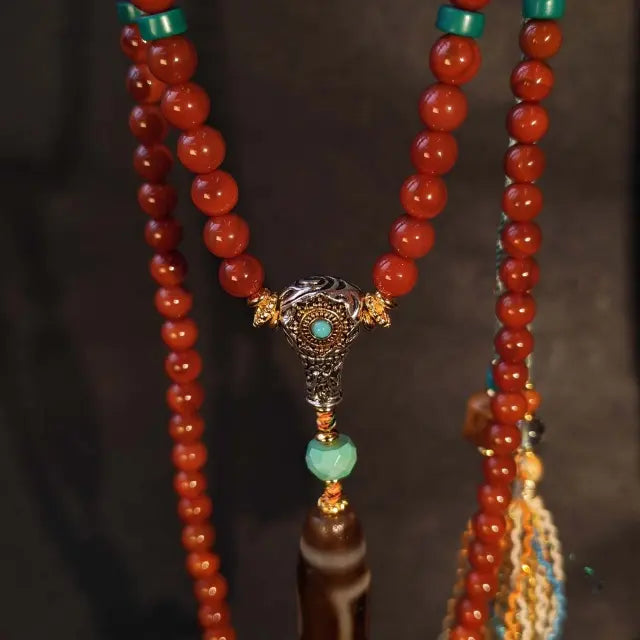 Handcrafted Tibetan red agate beaded necklace with Dzi bead pendant and turquoise brass detailing