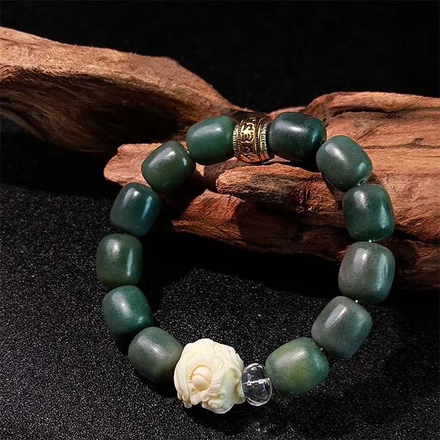 Awakening Lion charm bracelet made with authentic green Bodhi seeds, a unisex spiritual accessory for men and women seeking strength and clarity.