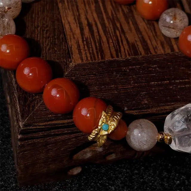 Healing energy bracelet made with Red Agate, Super Seven, and White Crystal stones, crafted to provide spiritual balance and protection for daily wear.