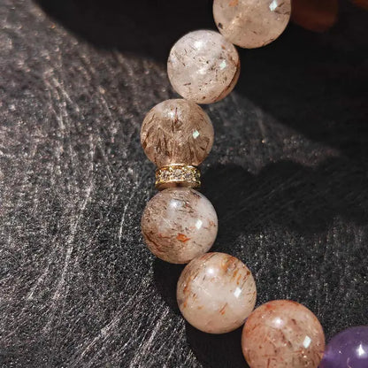Natural gemstone bracelet made with Super Seven, amethyst, and moonstone beads, perfect for spiritual healing and daily wear to promote energetic harmony.