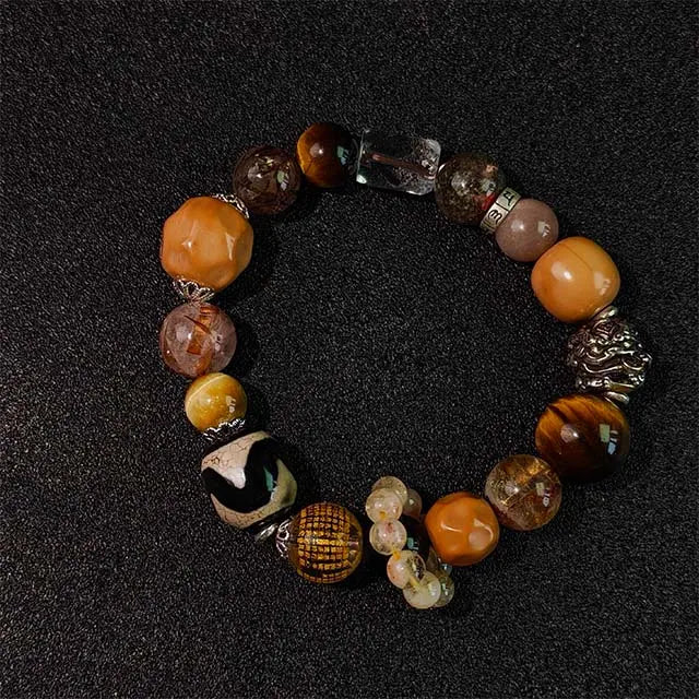 Wear this natural Golden Rutilated Quartz (Super Seven) healing bracelet for meditation, chakra alignment, and positive energy in daily life.