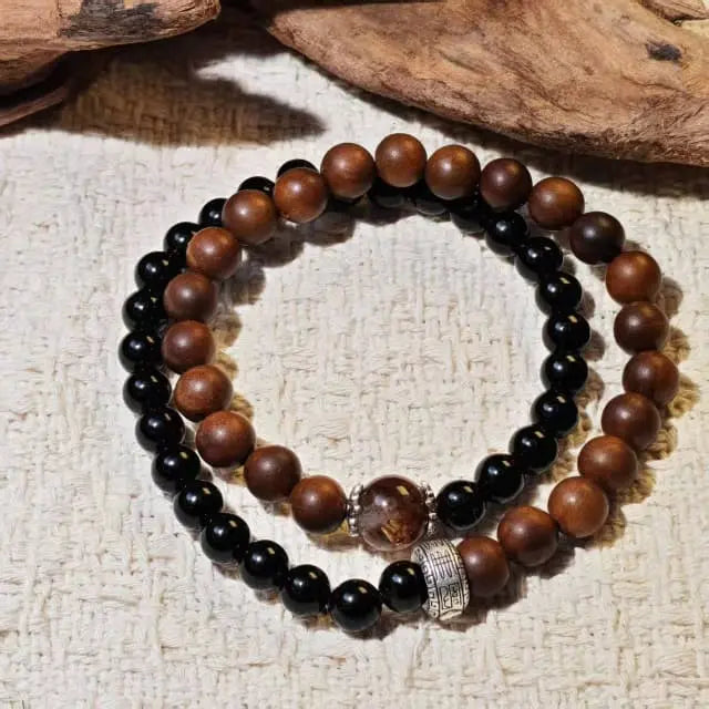 Double strand bracelet made with Black Obsidian for protection and Super Seven for spiritual healing, combined with unique Thunderstruck Wood beads. A powerful unisex crystal jewelry piece.