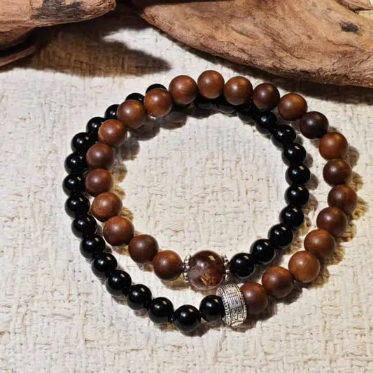 Double strand bracelet made with Black Obsidian for protection and Super Seven for spiritual healing, combined with unique Thunderstruck Wood beads. A powerful unisex crystal jewelry piece.