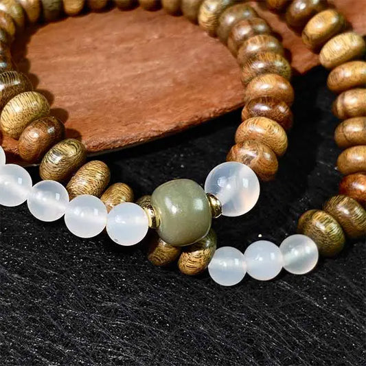Spiritual healing bracelet for women and men, featuring green sandalwood and white agate in a double wrap design for positive energy and protection.