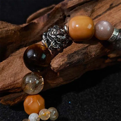 Handmade natural healing crystal bracelet made with Golden Rutilated Quartz (Super Seven) stones, designed to balance energy and promote well-being.