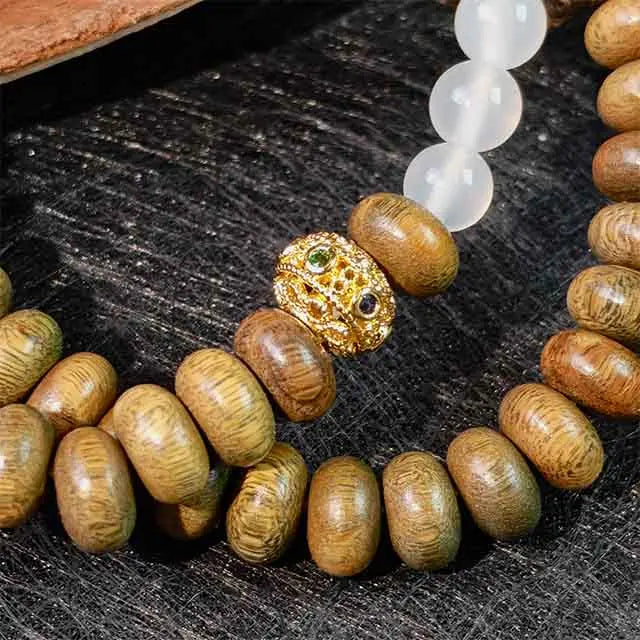 Green sandalwood and white agate double wrap bracelet, handmade bohemian style jewelry for meditation, yoga, and everyday spiritual wear.