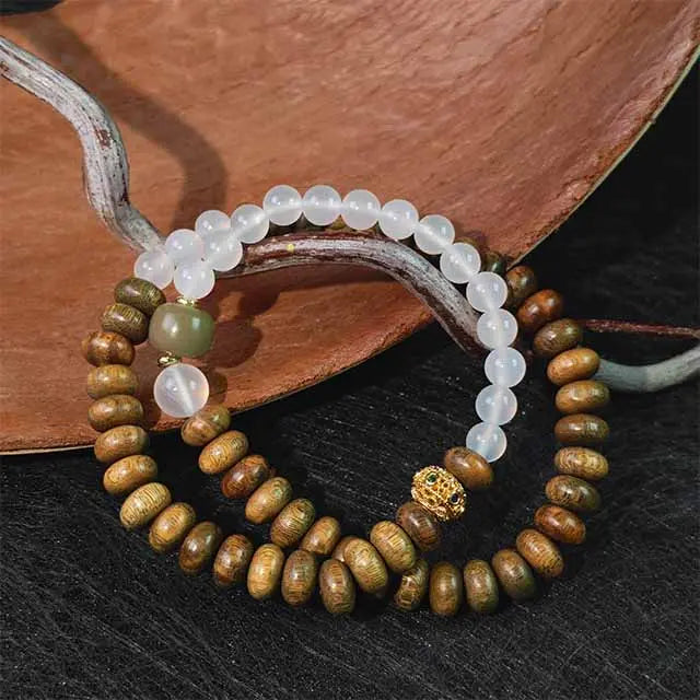 Handmade double wrap bracelet with green sandalwood and white agate beads, natural spiritual jewelry for mindfulness and energy balance.