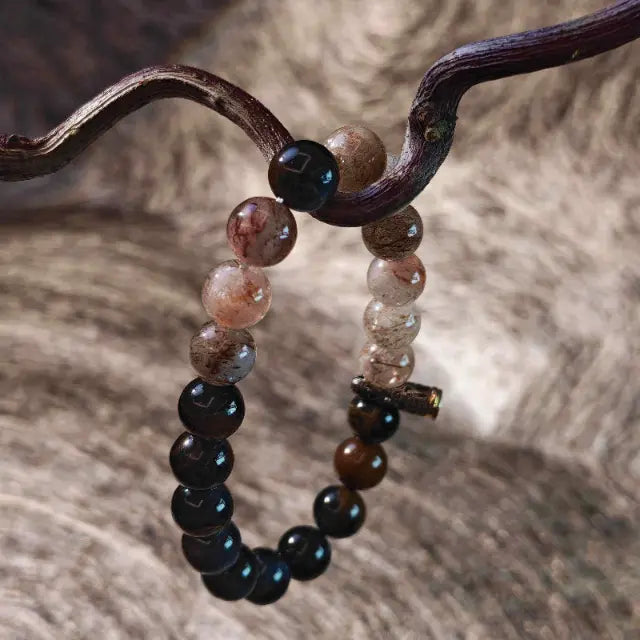 Unique handmade healing jewelry: A striking bracelet combining grounding Tiger’s Eye and high-vibration Super Seven crystals, set in ornate Tibetan silver for a one-of-a-kind look.