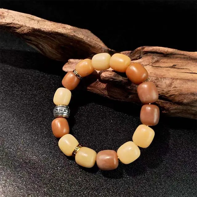 Handmade Bodhi seed bracelet for mindfulness, made of natural wooden beads with a brown braided cord. A minimalist spiritual accessory for meditation and daily blessings.