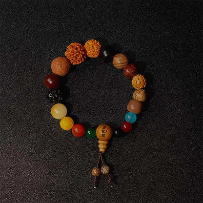 Handcrafted Bodhi Mala bracelet made of 18 natural ebony wood and agate stone beads, designed for yoga, meditation, and mindfulness practice.