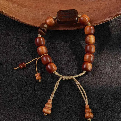  Handmade Himalayan-inspired mala bracelet for meditation, crafted from aromatic Thuja wood and rare Black Persimmon wood beads. A unique spiritual gift.