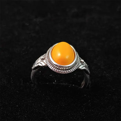 The Himalayan Sun - A handmade unisex ring featuring a warm, natural Tibetan yellow amber stone set in a rustic sterling silver band.