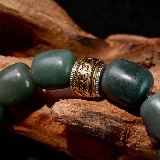 Mindfulness bracelet with natural green Bodhi seeds and a handcrafted copper lion charm, a unique gift for meditation and spiritual inspiration.