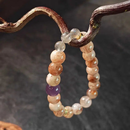 Genuine Super Seven crystal bracelet featuring amethyst and moonstone, designed for meditation and energy healing to balance the seven chakras.