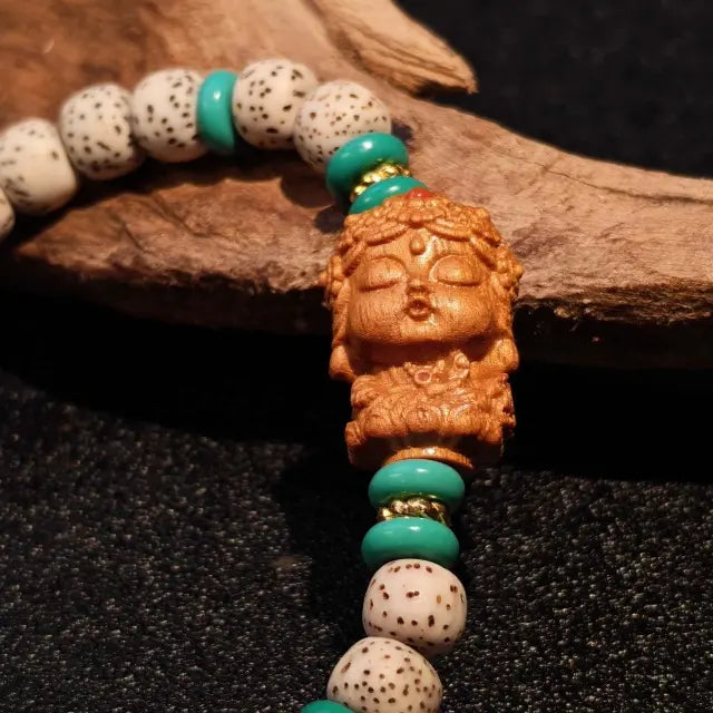 sandalwood accent bead detail on tibetan style handmade bead bracelet