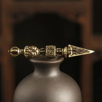 solid brass dorje pendant tibetan style handcrafted ornament with symmetrical design