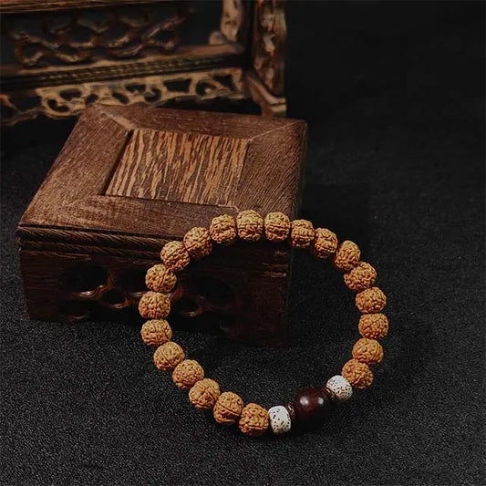 A spiritual energy mala bracelet for yoga and meditation practice, promoting calmness and positive energy, displayed on a minimalist neutral background.
