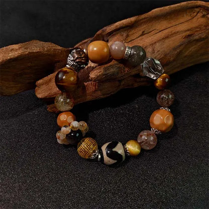 A natural Super Seven Golden Rutilated Quartz bracelet for chakra balancing and energy healing. Features genuine crystals on an adjustable string.