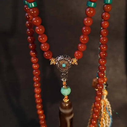 Handcrafted Tibetan red agate beaded necklace with Dzi bead pendant and turquoise brass detailing