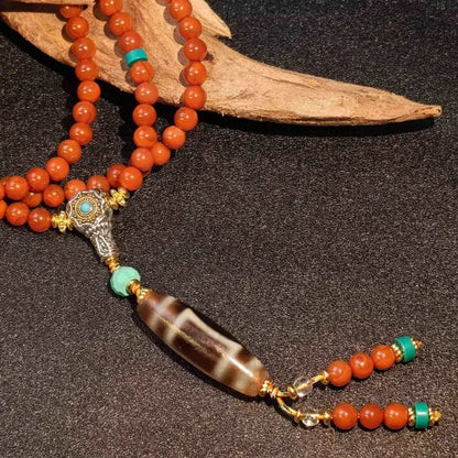 Handcrafted Tibetan red agate mala necklace with elongated Dzi bead pendant and turquoise brass accents
