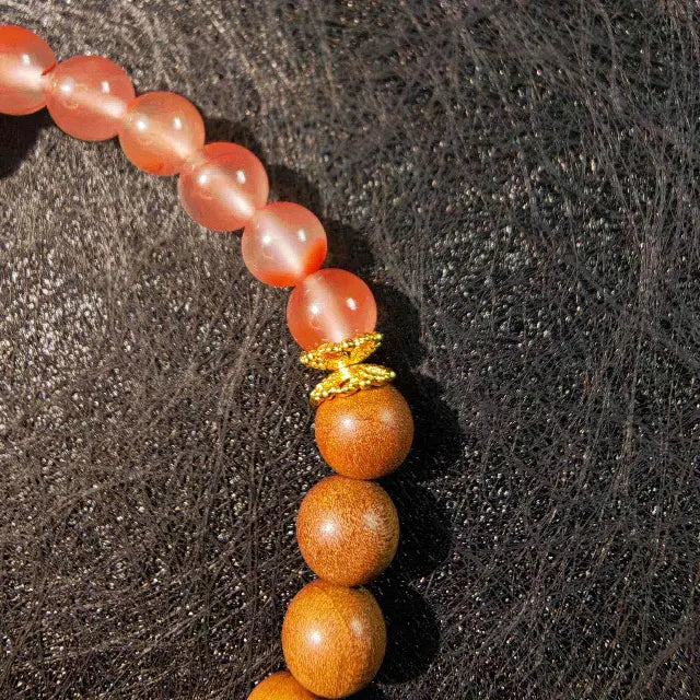 Zen meditation bracelet handmade from sandalwood and gourd beads. Designed for spiritual mindfulness, each bead symbolizes grounding and positive energy flow.
